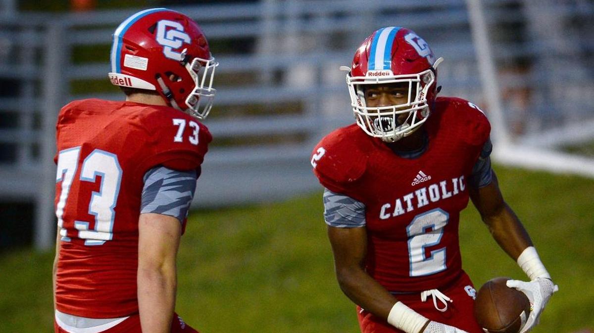 Charlotte Catholic tackle Jacob Smith, left, and running back Milan Howard, right, will play for the Cougars in the Southern Carolinas championship game Friday at Marvin Ridge