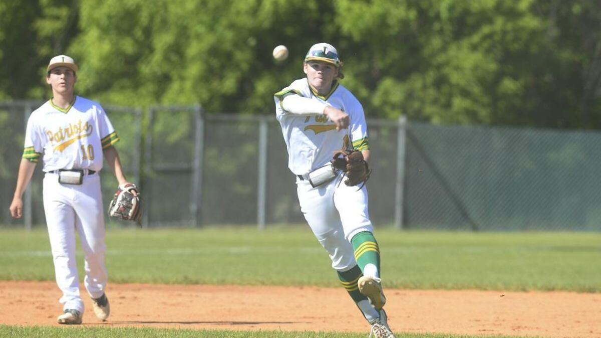 Independence High's Ryan Magnum (14) and the Patriots won a first-round NCHSAA playoff game Tuesday