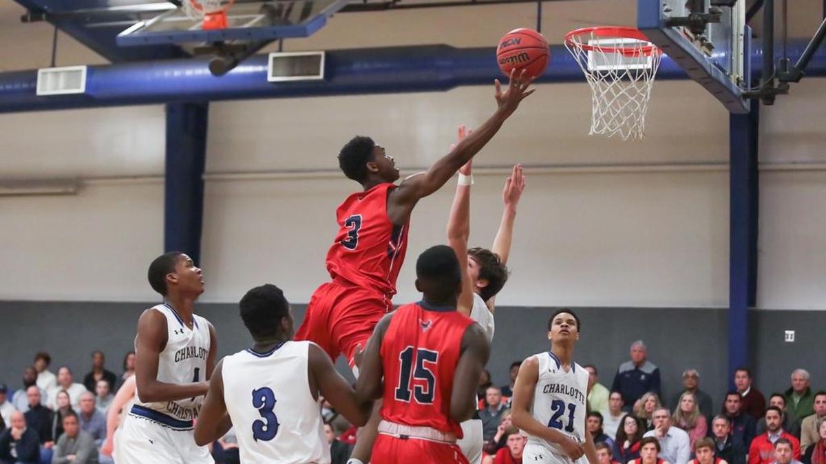 Providence Day's Trey Wertz takes on the Charlotte Christian defense and scores a layup in the Chargers’ 81-65 win on the road Tuesday