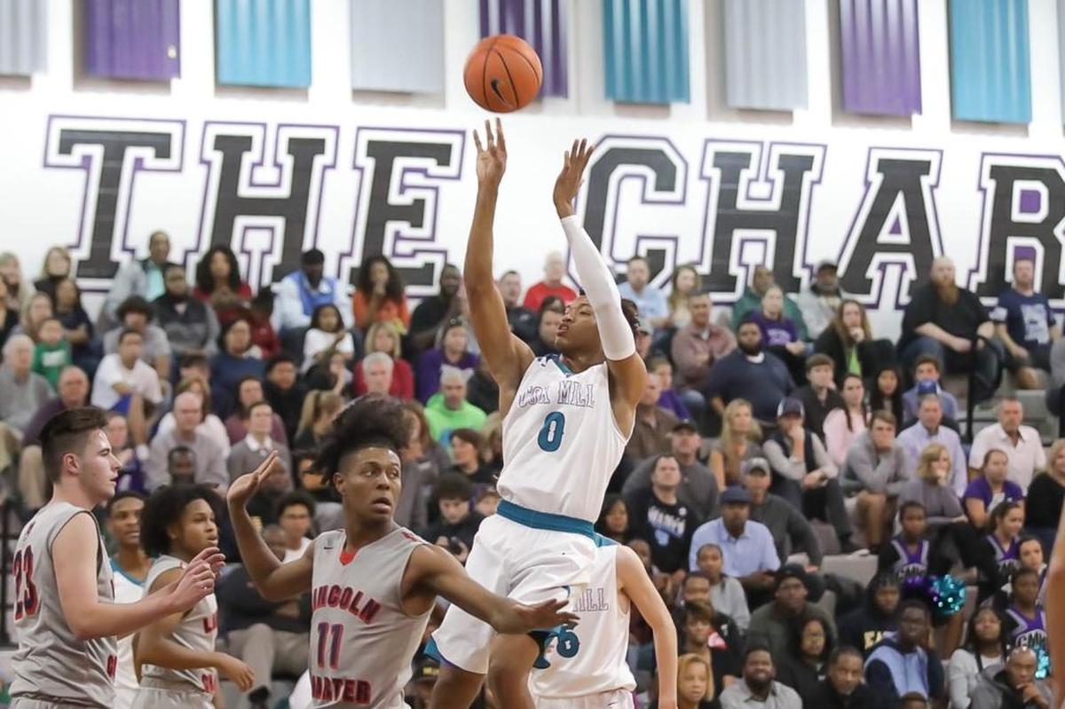 Cox Mill's Wendell Moore Jr. pulls up center of the lane during early first half action. Cox Mill would host Lincoln Charter Wednesday December 13, 2017