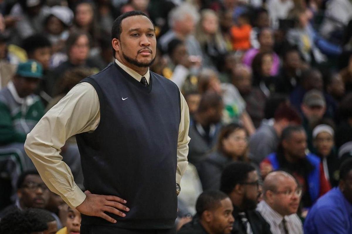 Independence coach Preston Davis watches his team during the first half of the Butler-Independence game on Friday, Dec. 14, 2017.