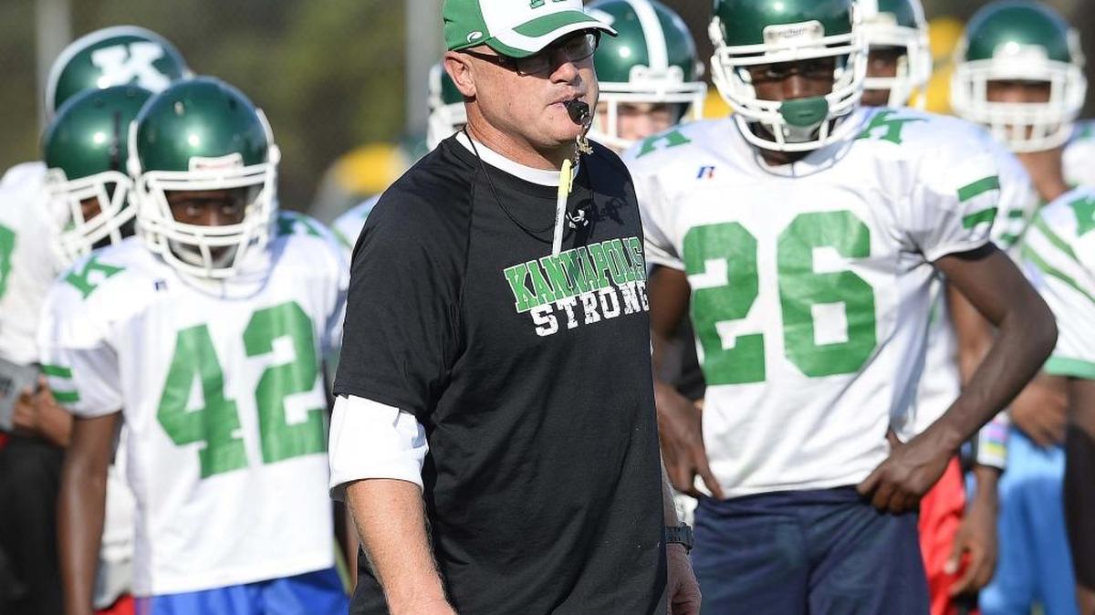 AL Brown head football coach Mike Newsome instructs his team during football practice on September 30,2015.