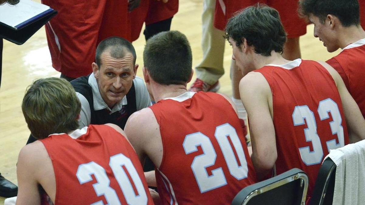 Charlotte Catholic head coach Mike King led his team a high school basketball win Tuesday
