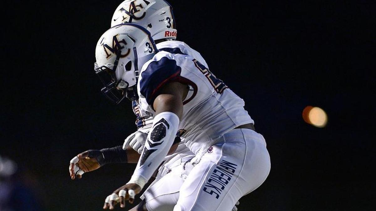 Mallard Creek linebacker Masanka Kanku, left and the Mavericks are No. 2 in the Observer’s Sweet 16 poll