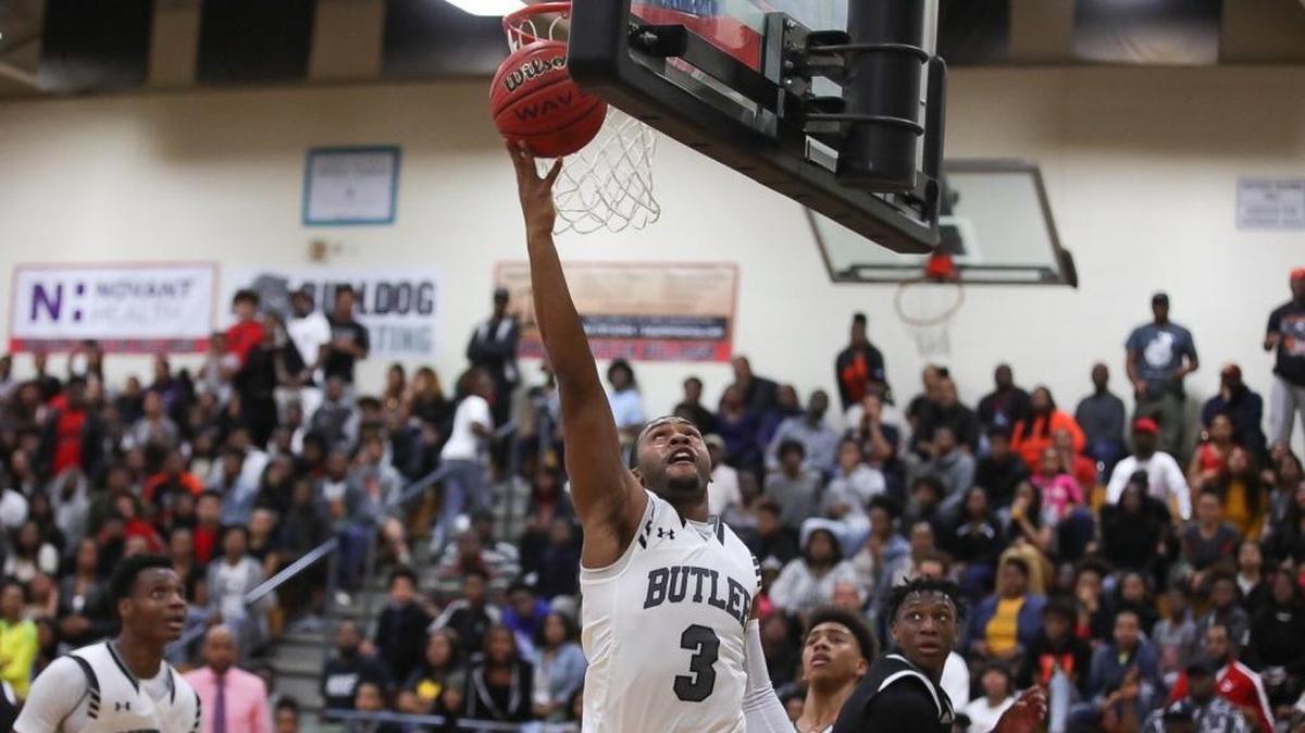 Butler's DJ Little (3) completes the reverse layup during Tuesday's matchup with the Raven's from Rocky RIver.