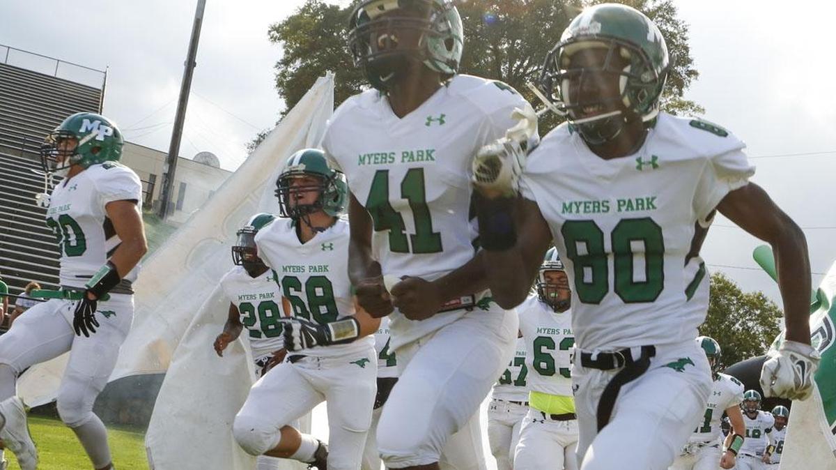 
Myers Park Mustangs Randy Logan (41) and Emmanuel Alston (80) take the field before the Aug. 22 game against Charlotte Country Day. Sun Valley visits Myers Park this Friday.
