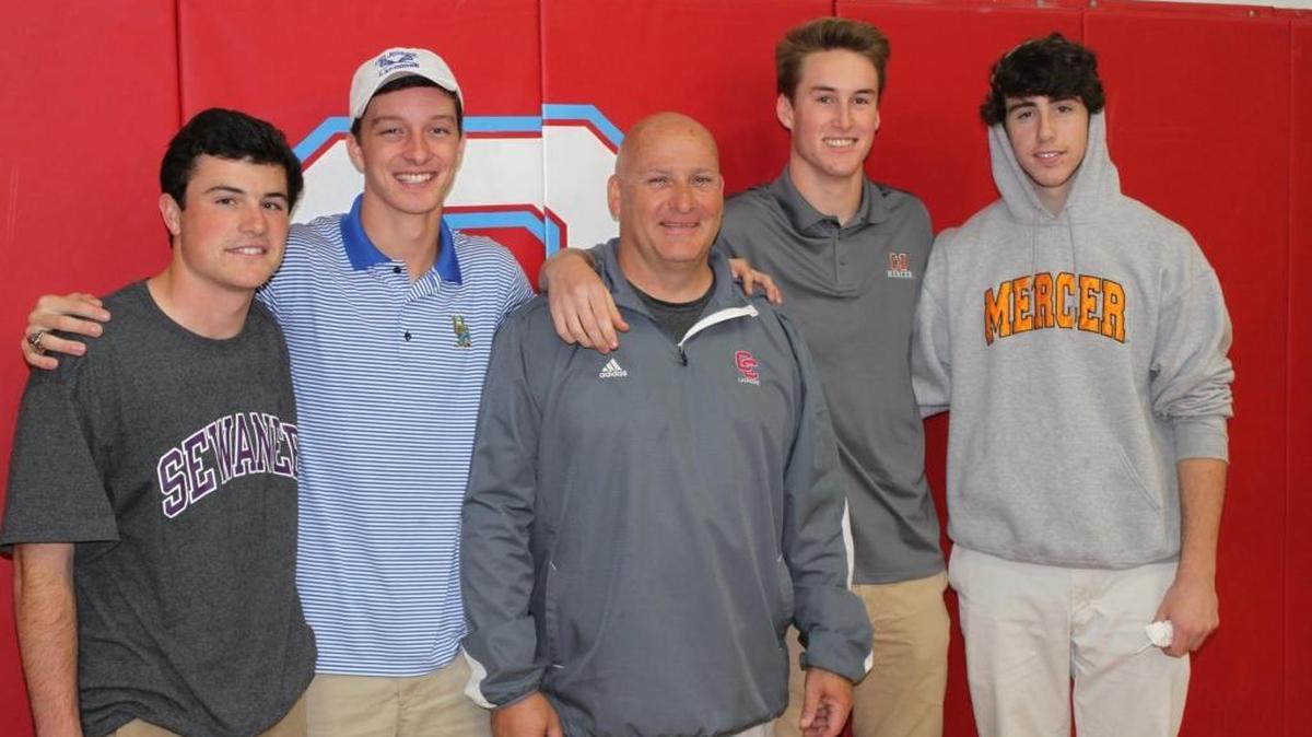 Charlotte Catholic lacrosse coach Bo Turner (center) with his team’s 2016 college commits on National Signing Day, November 11th. Left to right: Ryan Young-Sewanee, Zach Strassner-University of Delaware, Jackson Harris-Mercer University, Michael O’Brien-Mercer University.