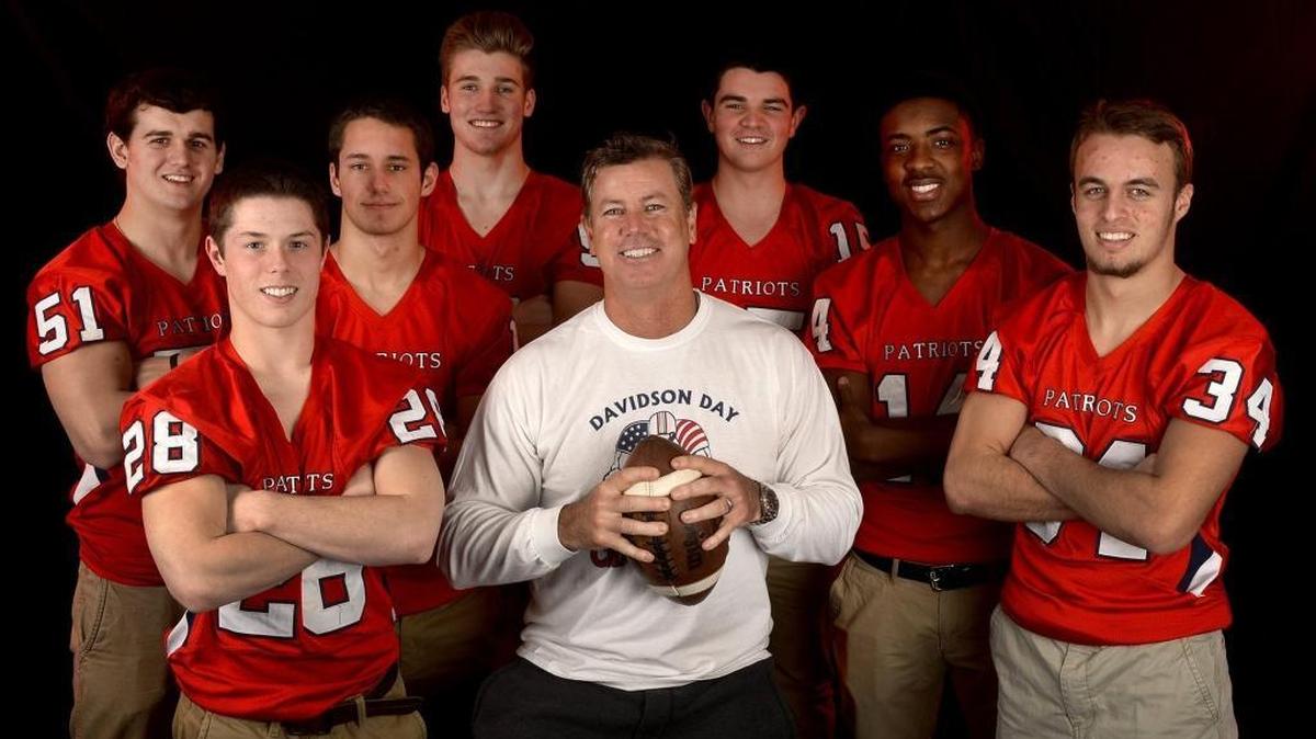 Five years ago, Davidson Day coach Chad Grier (center) led the Patriots to a 12-0 record. Grier is the new head coach at Providence Day School