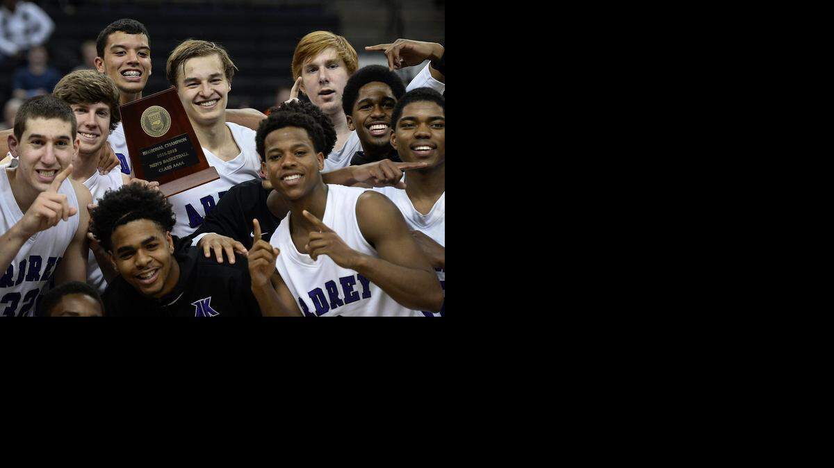 
(Back Center with trophy) Ardrey Kell's Steven Santa Ana  and his teammates pose with the regional championship trophy after he hit the game-winning 3-point shot in the closing seconds vs. West Charlotte in the N.C. 4A Western Regional championship. Ardrey Kell won the Observer’s Sweet 16 championship Tuesday. 
