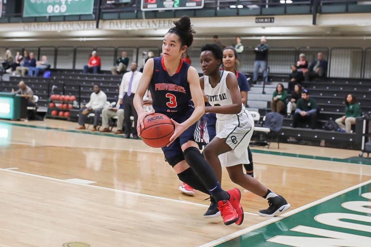 Providence Day’s Nina-Simone Clark (3) drives the baseline during Friday’s game against Charlotte Country Day.