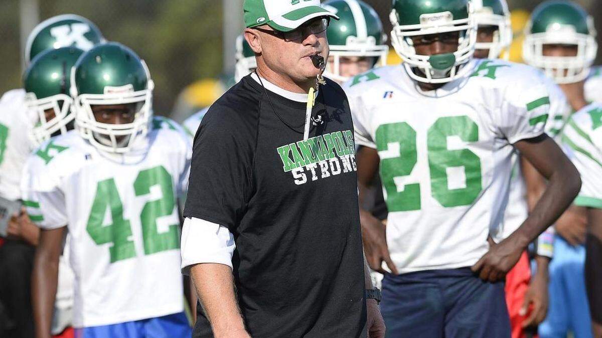 
A.L. Brown head football coach Mike Newsome instructs his team during football practice on Wednesday. 
