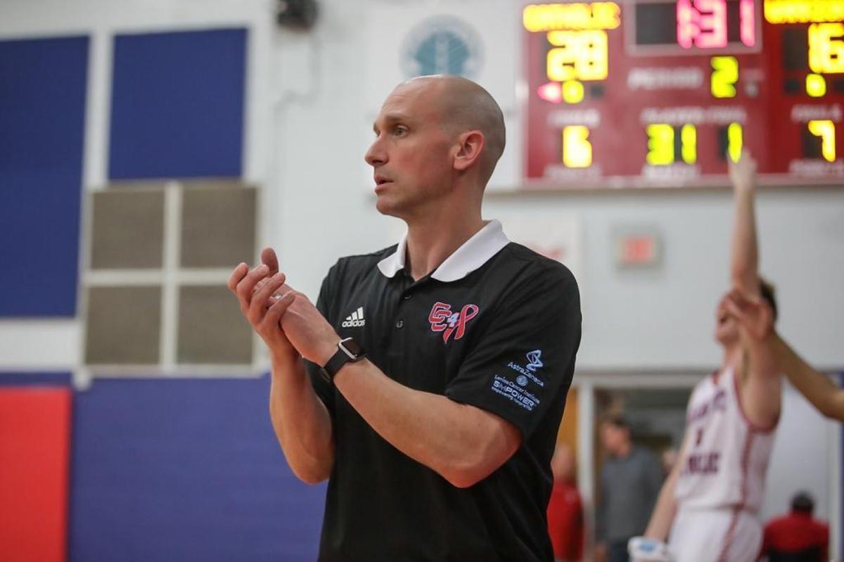 Charlotte Catholic Head Coach Mike King cheers on his team late in the first half. Charlotte Catholic defeated Weddington Friday, Jan. 26, 2018.