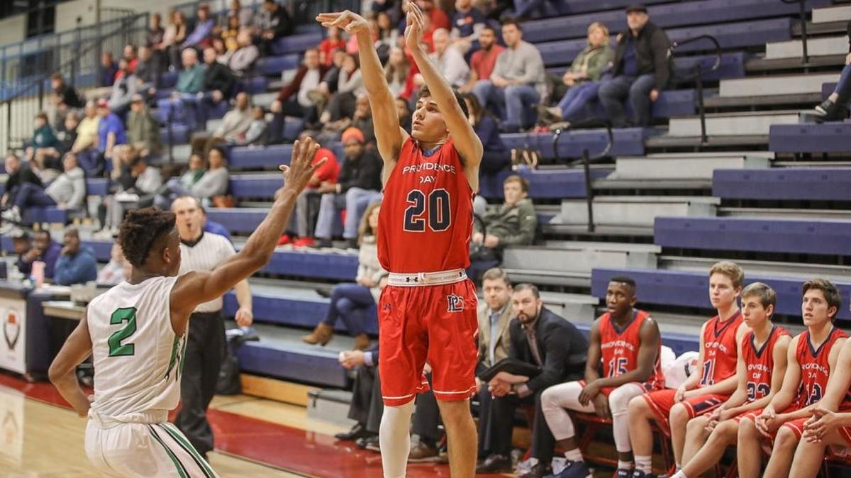 Guard Kyle Wood of Providence Day (20), pulls up and attempts a three point shot during early 3rd quarter action. Providence Day would play Fort Myers at the 2017 Hoodie's House High School Hoops Classic December 27, 2017.