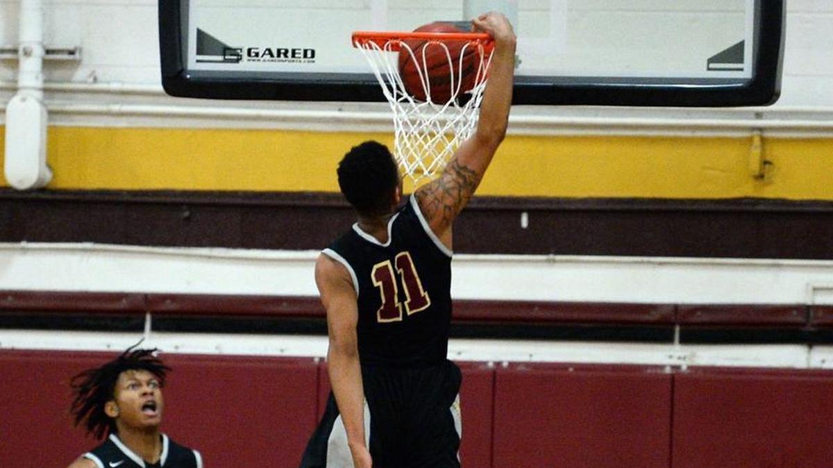 Harding University's Quinten Thomas, center, throws down a one-handed dunk against West Charlotte during first half action on Tuesday, November 21, 2017. Harding defeated West Charlotte in overtime 44-43.