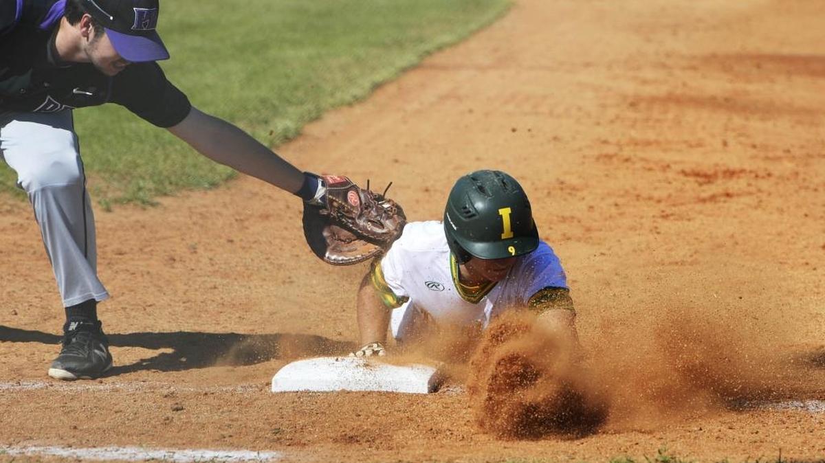 Independence High's Nate Brown (9) dives safely back to first as Porter Ridge's Price Hargett (17) applies the tag at first base in the the bottom of the 3rd inning during the first round of Southwestern 4A semifinals t Hickory Ridge High .on Monday, April 30, 2018.
