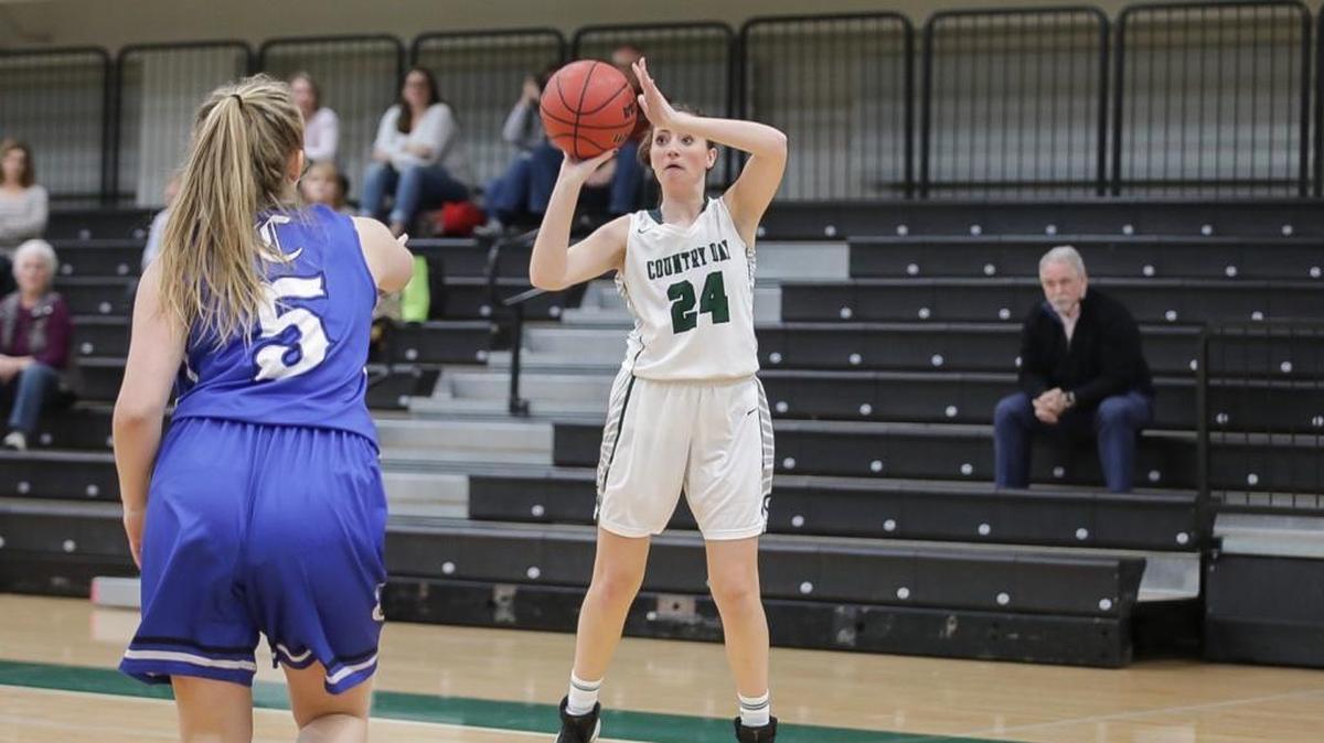 Molly McLawhorn (24) attempts a 3 point basket during late 1st half action. Charlotte Country Day would host Charlotte Christian January 9, 2018.