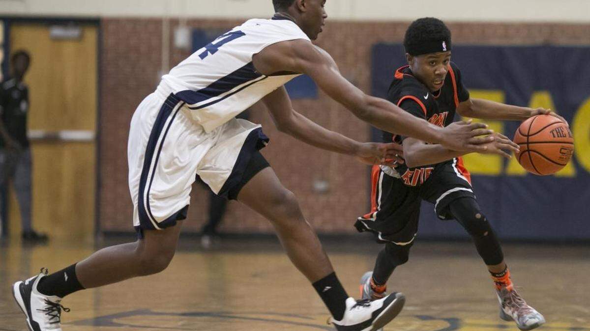 Rocky River's Elijah Sidbury, right, drives up court while facing East Meck during a prep basketball game Tuesday, December 15, 2015 at East Meck High School. JASON E. MICZEK - Special to the Observer