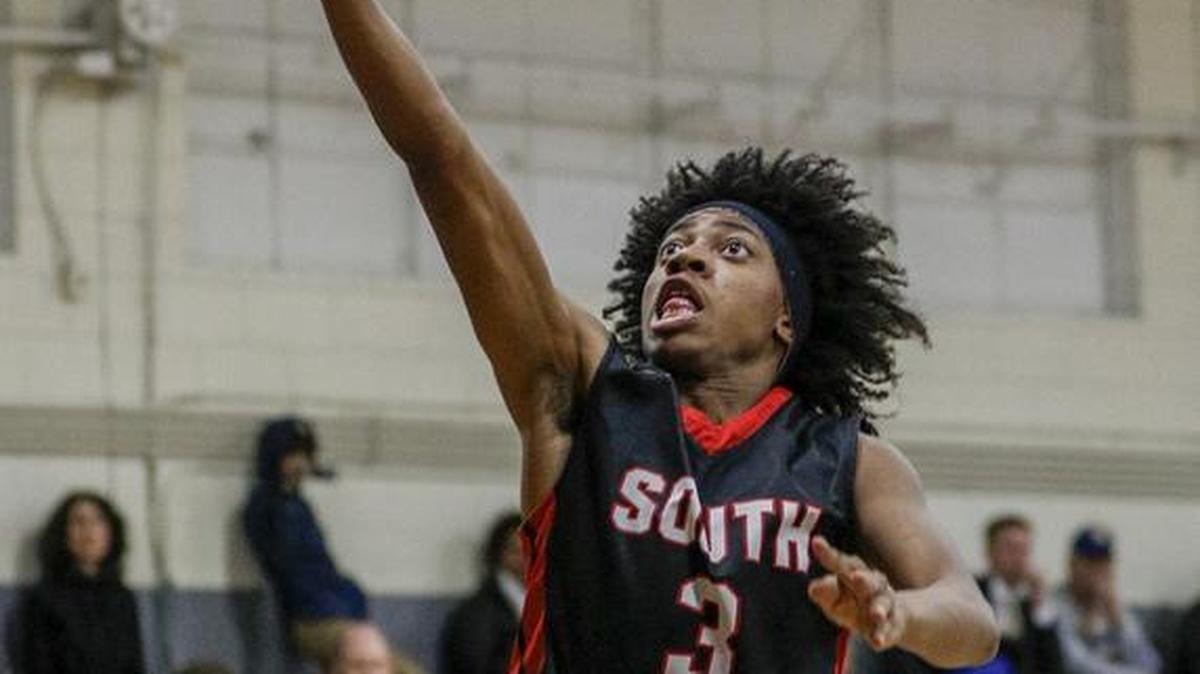 South Meck guard Derrick Walker scores against West Meck in the first half of a high school basketball game in Charlotte, N.C., Friday, Jan. 27, 2017. (Nell Redmond photo)