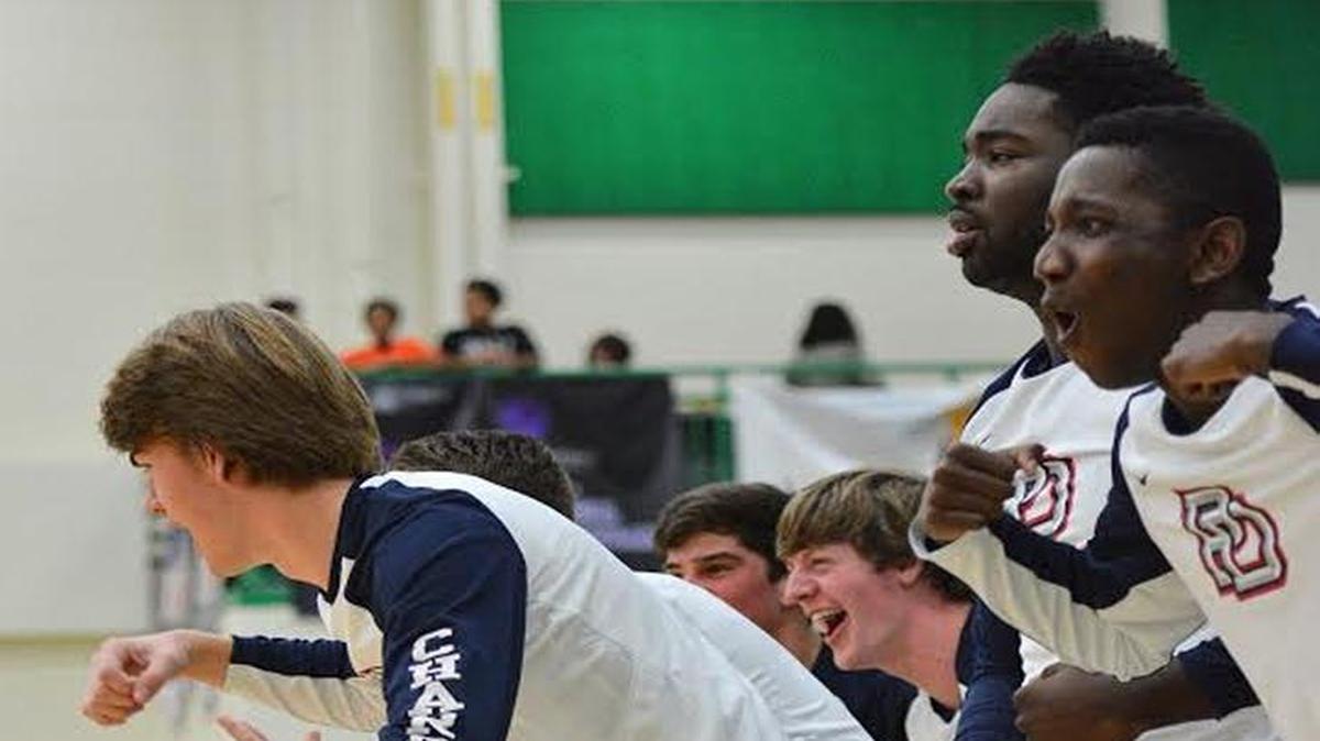 Providence Day players celebrate a win during a Thanksgiving tournament
