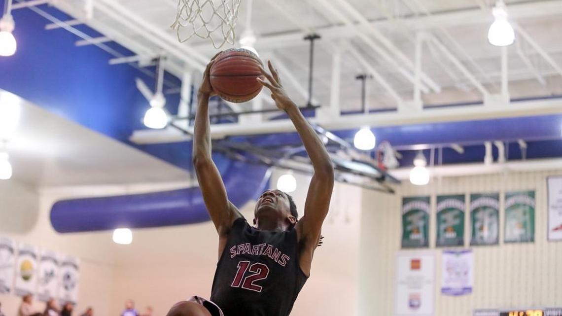 Sun Valley's Raheem Howard dribbles the lane for the layup during late first-half action. Sun Valley would defeat Weddington at the buzzer, 48-46.