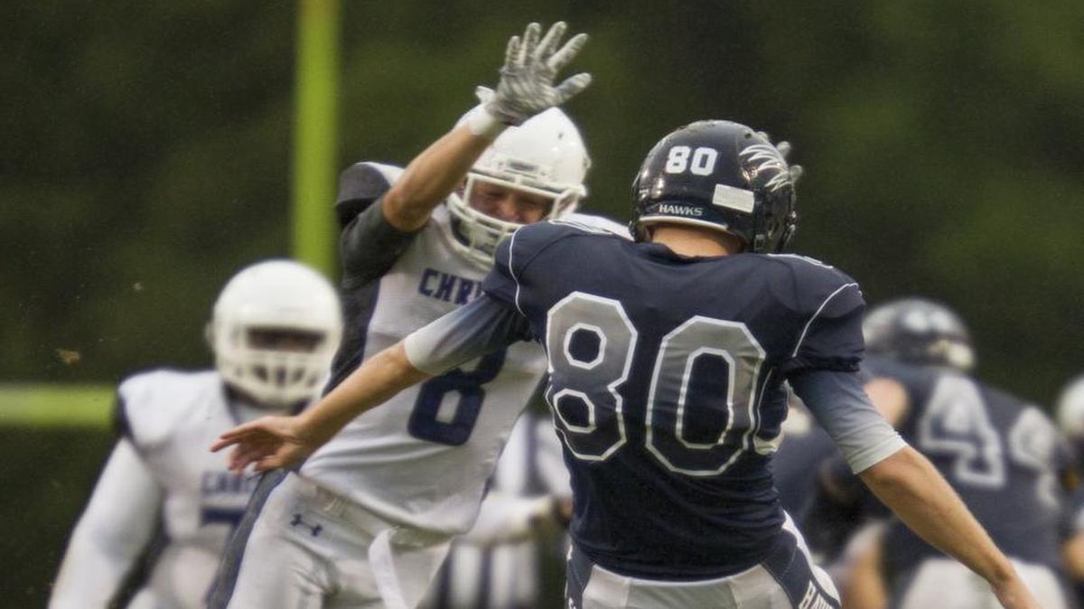 
Charlotte Christian's Grant Armistead (8) blocks a punt from Charlotte Latin's Tommy Hawkyard (80) setting up the Knights for a touchdown series during a prep football game Friday at Charlotte Latin School. 
