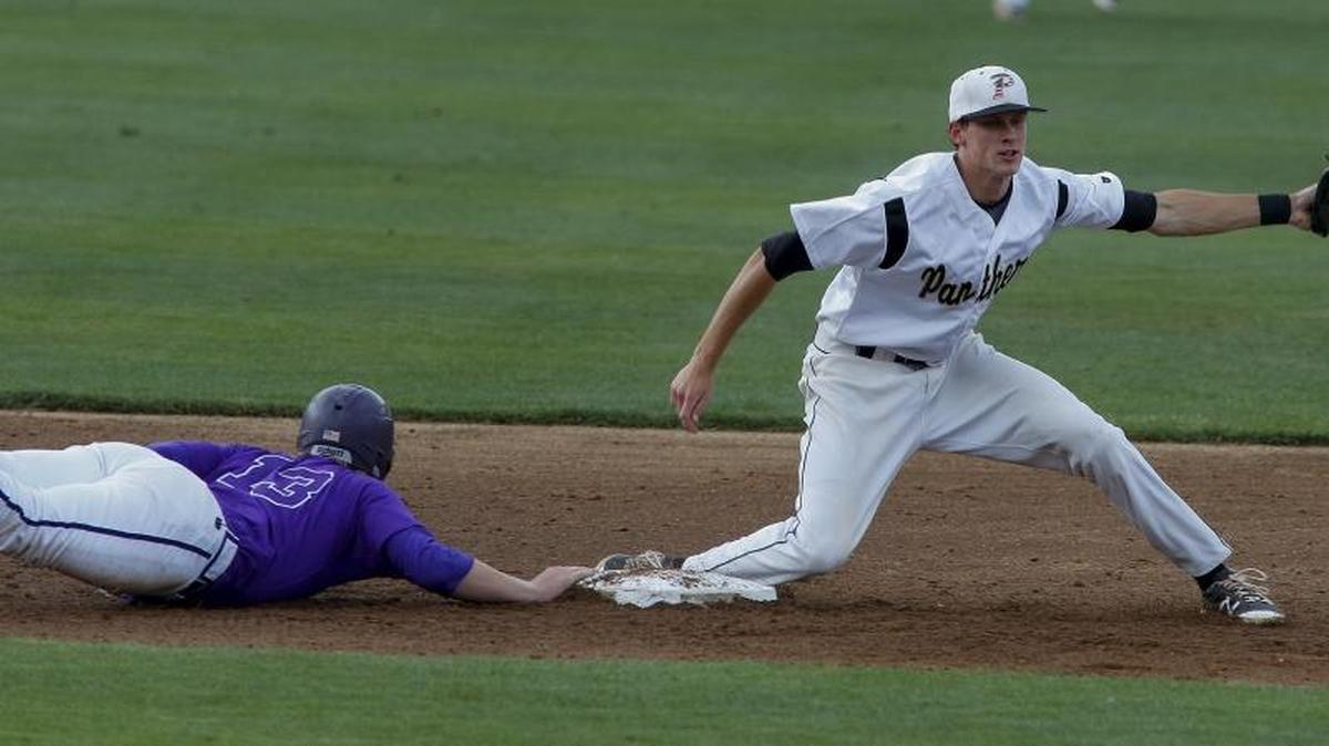 Ardrey Kell baserunner Henry Ryan, left, slides back into second base safely at Providence's shortstop Logan Davidson stretches to catch the pick-off throw in a second round baseball game in Charlotte, N.C., Saturday, May 14, 2016. (Nell Redmond photo)