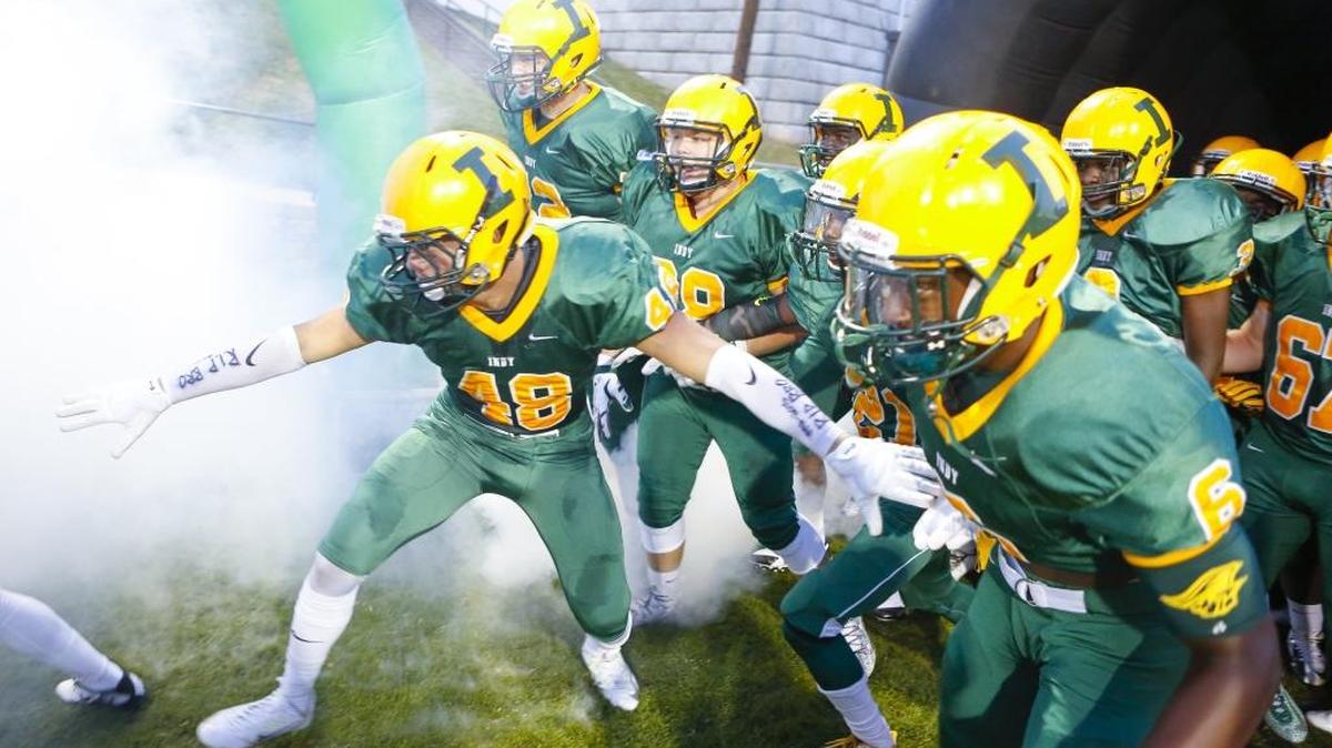 After a slow 0-2 start, Independence and Brandon Karshner (48) -- seen leading the Patriots onto the field at Memorial Stadium earlier this season -- is in position to win a second straight league title. Photo by JASON E. MICZEK - Special to the Observer