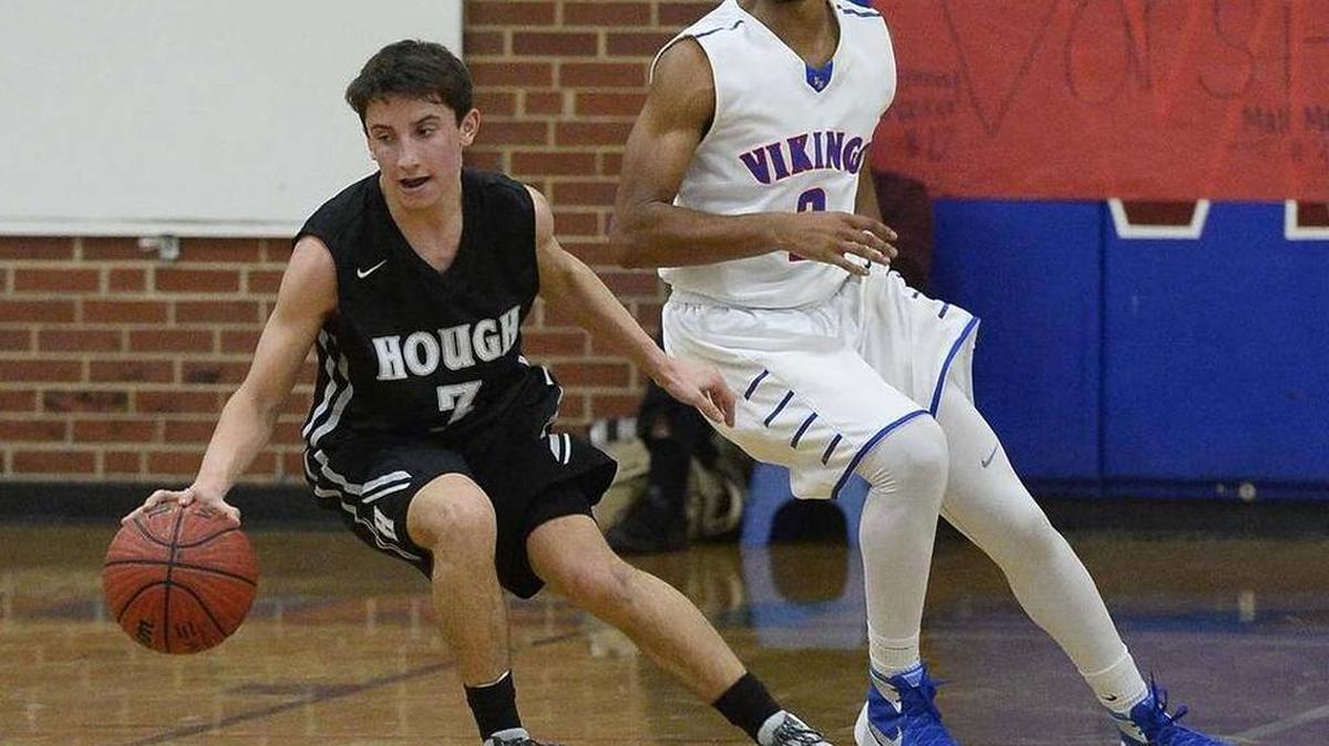 Hough’s Chase Praeger (left) handles the ball against North Meck last season. The teams meet again Wednesday at Hough