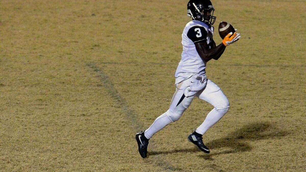 Hough’s Marquill Osborne, seen here in action in October, stopped a two-point try in overtime Thursday night to give the Huskies a 28-27 win and their first MECKA 4A championship. Osborne’s stop was the finale in a stirring effort in which he scored touchdowns receiving (66 yards), on a kick return (94 yards) and blocked a field goal attempt.