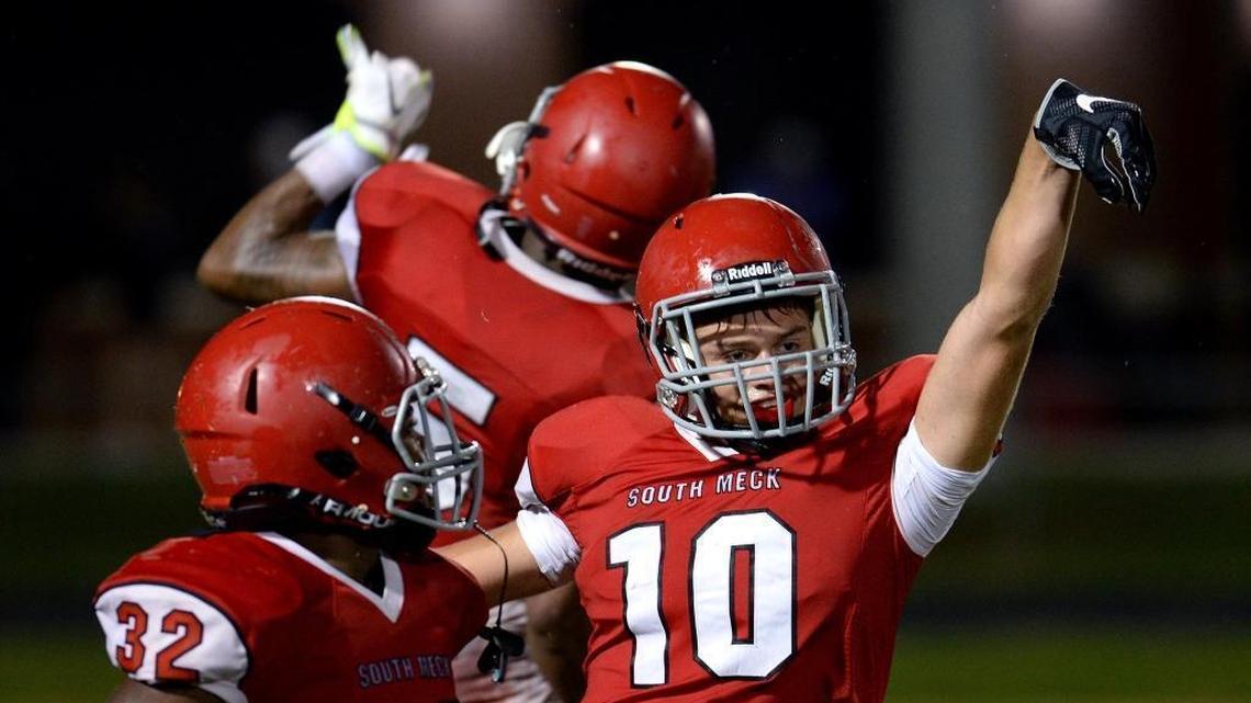 South Meck Sabres Donnie Both, right, celebrates his touchdown pass reception vs Marvin Ridge during fourth quarter action at South Meck High School on Friday, August 19, 2016. South Meck defeated Marvin Ridge 27-21.