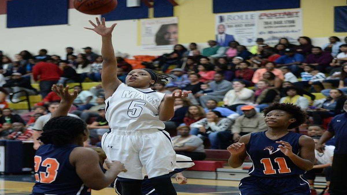 Mallard Creek Mavericks girls varsity play Vance Cougars in Friday's prep basketball game at Mallard Creek high. Mallard Creek Mavericks # 5 Kala Brown scores the jump shot of Vance Cougars # 11Tori Reed and # 23 Serenity Davis.