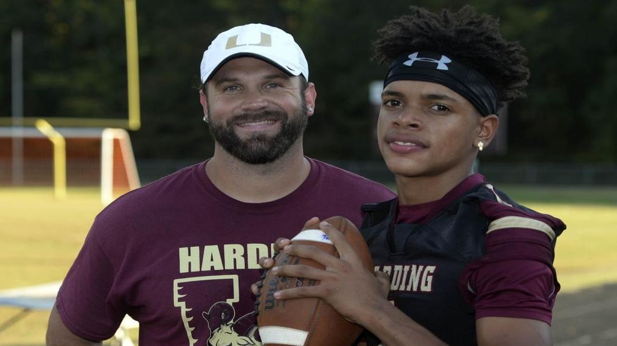 Harding coach Sam Greiner (left) moved QB Braheam Murphy (right) into his home last spring. Murphy started at QB last season and led Harding to its best season in nine years. Greiner was named SoMeck 8 conference coach of the year.