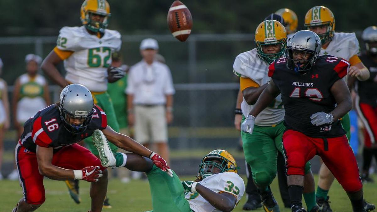 Richmond Senior’s Jahiem Covington loses the football as Butler linebacker Darius Law (16) and defensive lineman I’zure Glover (43) react in the first half of Friday’s high school footbal game in Matthews. Butler recovered the fumble, but it wasn’t enough. The Bulldogs lost 30-19 to the visiting Raiders.
