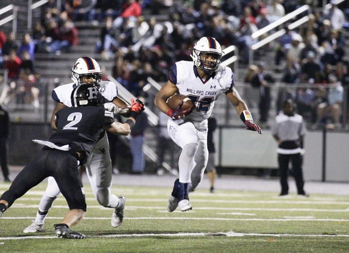 Mallard Creeks’ Trenton Simpson (22) finds a hole in the defense and picks up the first down against Hough in the fourth quarter Friday.