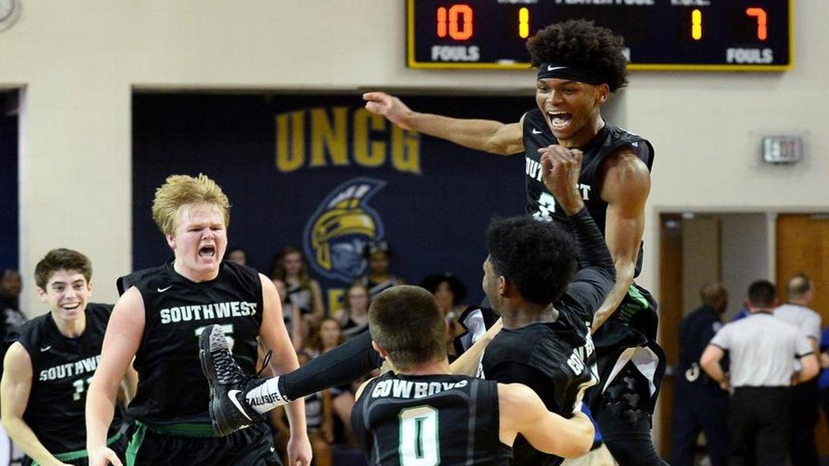 Southwest Guilford celebrates their victory over the Butler Bulldogs during the NCHSAA 4A Western Regional Championship on Saturday, March 4, 2017. Southwest Guilford defeated Butler 61-58 and advanced to Saturday’s state championship game.