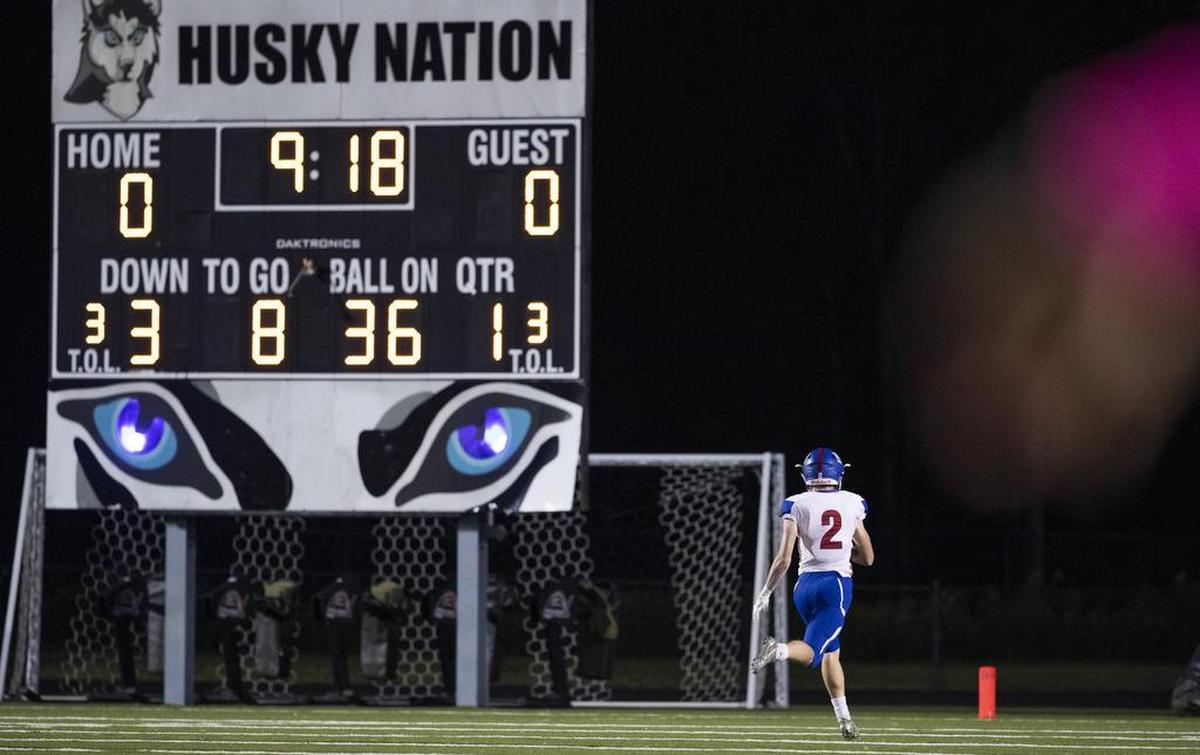 North Meck wide receiver Justin Olson gets an early touchdown against Hough in the first quarter of Friday’s football game.