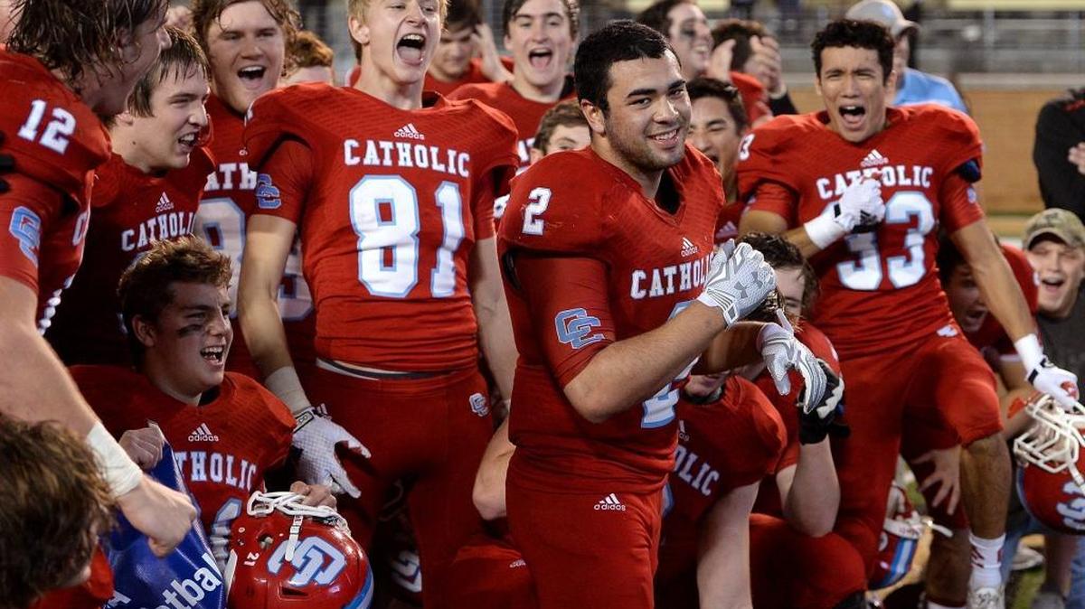 Charlotte Catholic players celebrate winning the N.C. 4A state football championship in December. Under a new NCHSAA proposal, Catholic would dip to the 3A class beginning in fall 2017 and play in a conference with Union County schools.