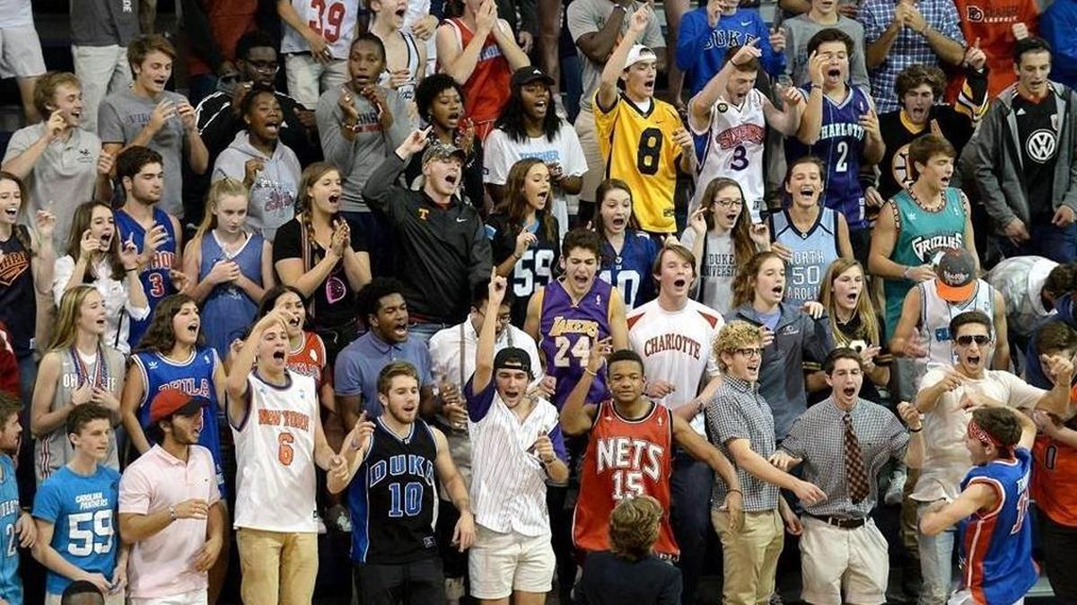 Fans at Providence Day School cheer a second half rally from their team. Down by more than 20 points, the Chargers stormed back behind guards Devon Dotson and Trey Wertz, but lost to nationally ranked High Point Wesleyan 80-76