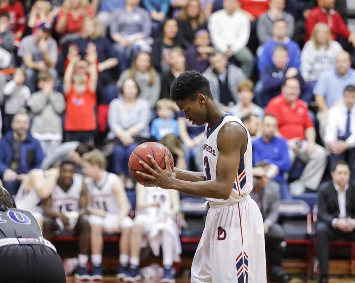 Providence Day's Trey Wertz prepares to shoot the go-ahead basket late in the fourth quarter. Providence Day advanced to the NCISAA 3A semifinals by defeating Charlotte Christian on Friday.