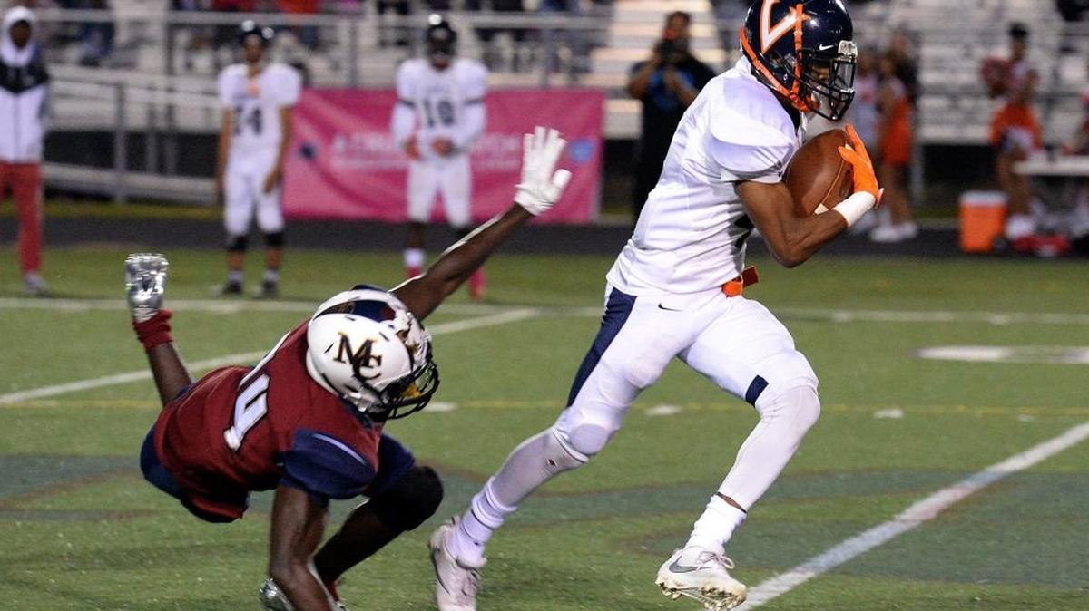 Vance receiver Jaylin Carr (right) pulls away for a touchdown after catching a pass from Kingsley Efedi in October against Mallard Creek. Friday, Vance and its high-scoring offense will visit Butler in the N.C. 4AA playoffs.