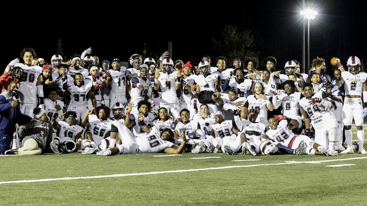 The Mallard Creek Mavericks celebrate a 26-10 win over Hough. Mallard Creek secured a share of theI-MECK 4A league title.
