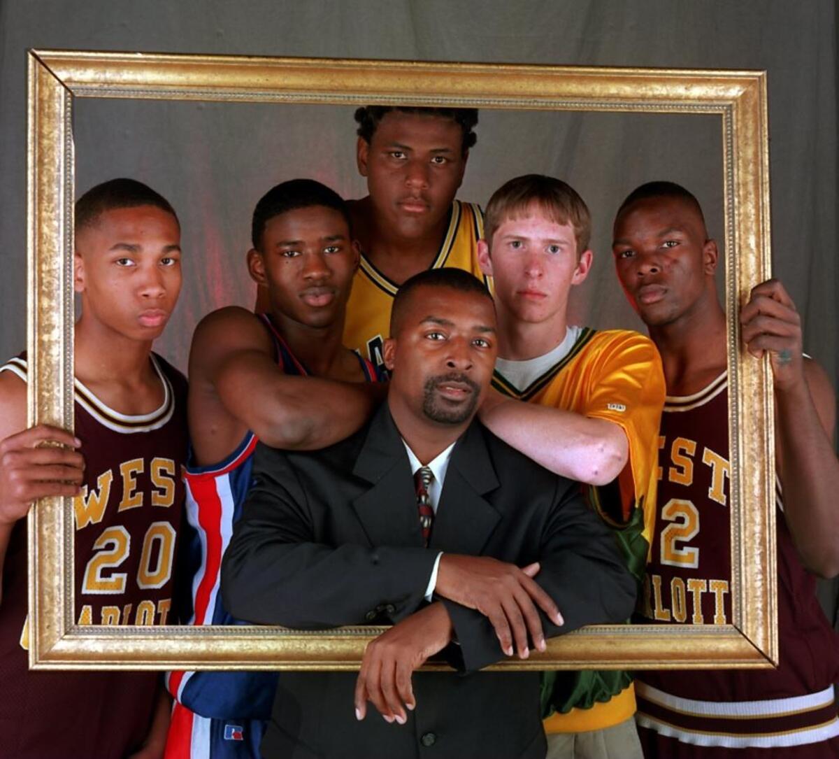 After he led Independence to a state title in 1997, Independence coach Tony Huggins (center) headlined the Observer’s All-Mecklenburg team, which included West Charlotte’s Keith Matkins (from left), Providence Day’s Brendon Rowell, East Mecklenburg’s Ray Henderson, Independence’s Jobey Thomas and West Charlotte’s Jahmad Woods.