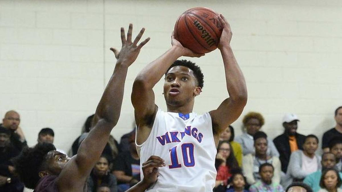 North Meck high's guard Davion Mintz on right, shoots the ball during Wednesday night's game played at North Meck high school Jan. 27, 2016.
