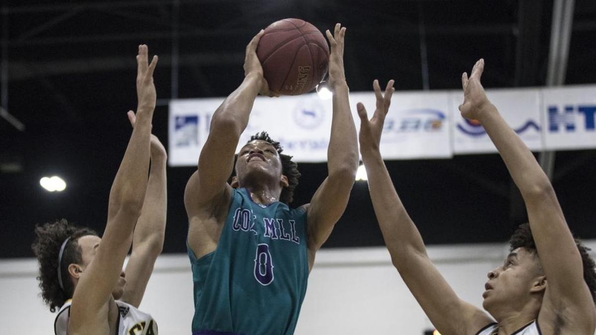 Cox Mill's Wendell Moore (center) is again the top ranked player in his class statewide