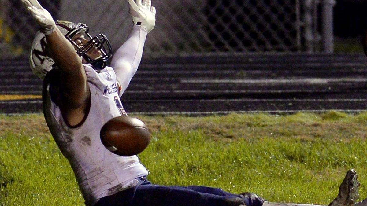 Mallard Creek tight end Thaddeus Moss celebrates a touchdown pass from quarterback James Smith last month against Butler. Saturday, the Mavericks will play Greensboro Page for the N.C. 4AA football championship.