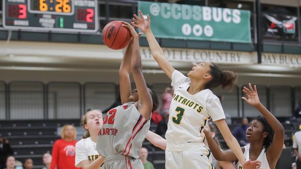 Hannah Hanslay of Lincoln Charter out rebounds Braylyn Milton (3) during early first half action. BSN Sports Queen City Clash December 21, 2017