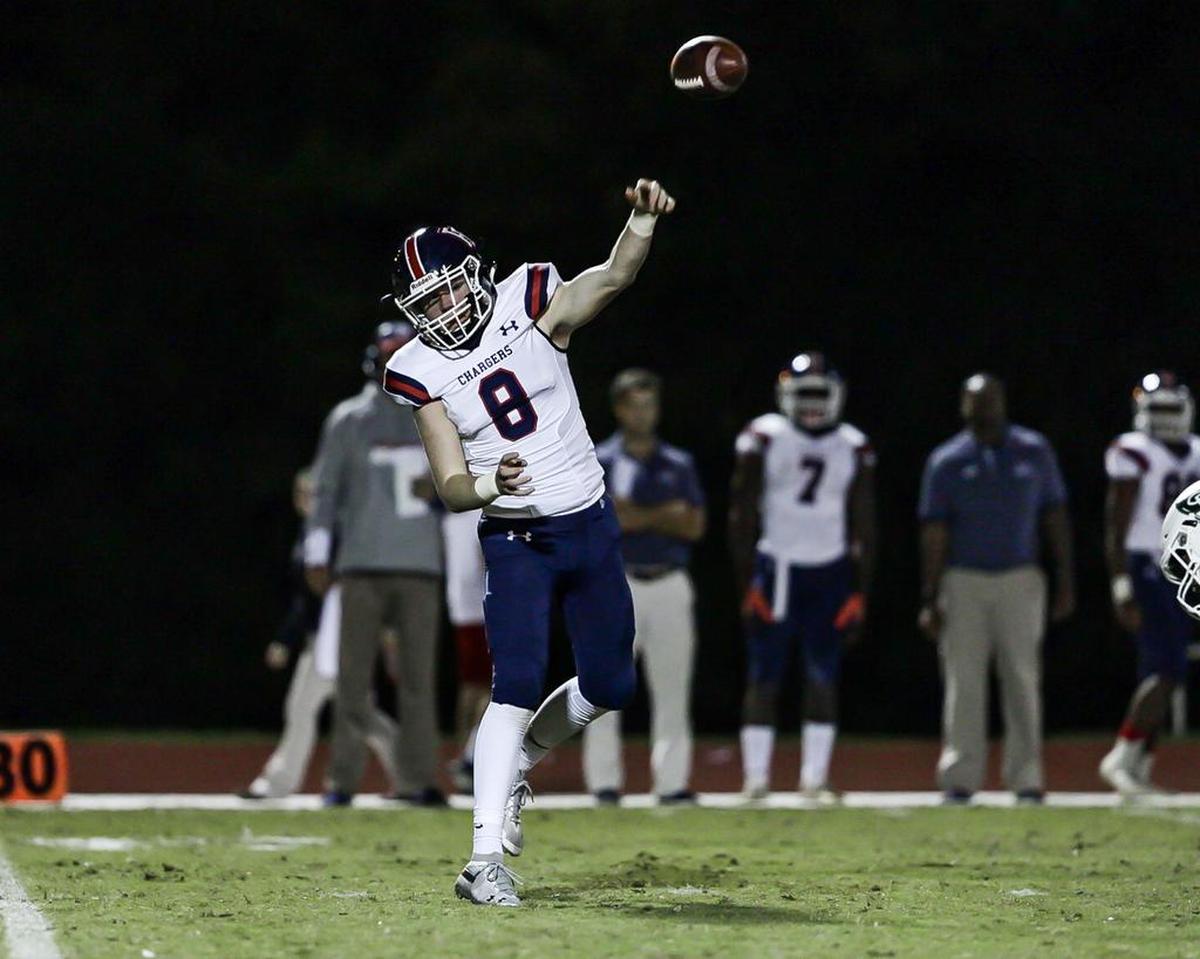 Providence Day’s Cody Cater (8) completes the screen pass in a CISAA conference win over Charlotte Country Day Friday