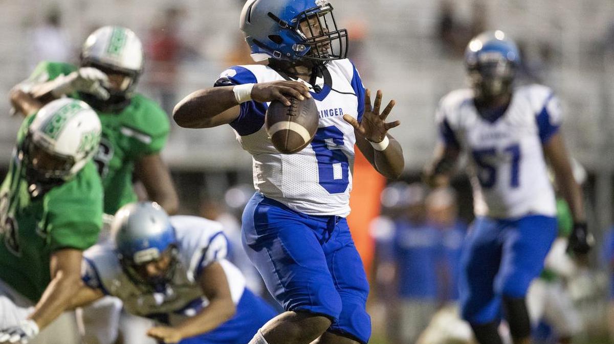 Garinger quarterback Antonio Smith drops back to pass against Myers Park during a prep football game at Myers Park High School Friday, September 21, 2018 in Charlotte, NC. Photo by JASON E. MICZEK - Special to the Observer