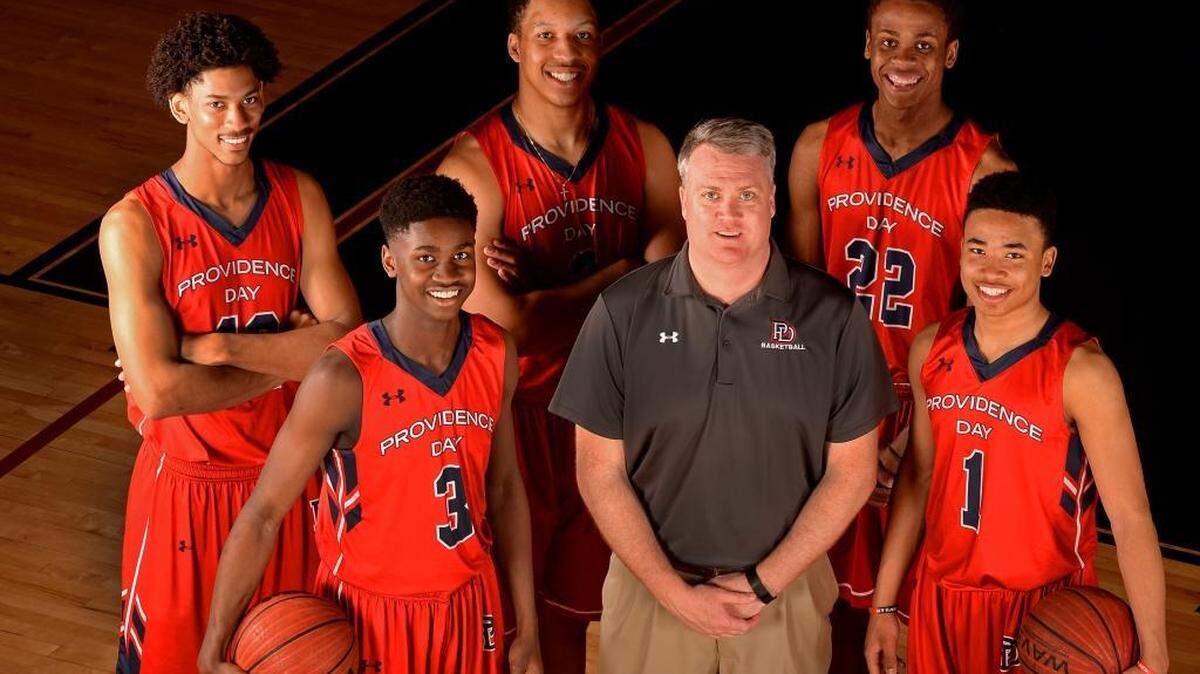 Starters for the Providence Day boys’ basketball team (L-R): Josh Howard (42), Trey Wertz (3), Grant Williams (2), coach Brian Field, Isaac Johnson (22) and Devon Dotson (1).