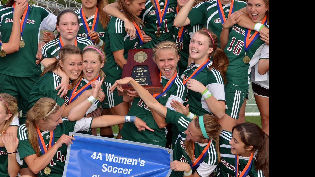 
Green Hope celebrates winning the NCHSAA 4A Girl's Soccer Championship against Hough 2-0 at Dail Soccer Field in Raleigh on Saturday, May 25, 2013. 
